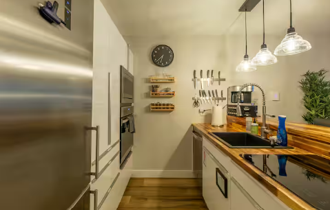 Gourmet kitchen with butcher block countertops at 11 Emmons Road ski rental